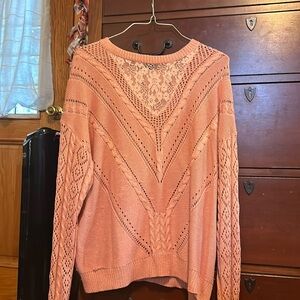 A cute laced pink sweater, very detailed and cute